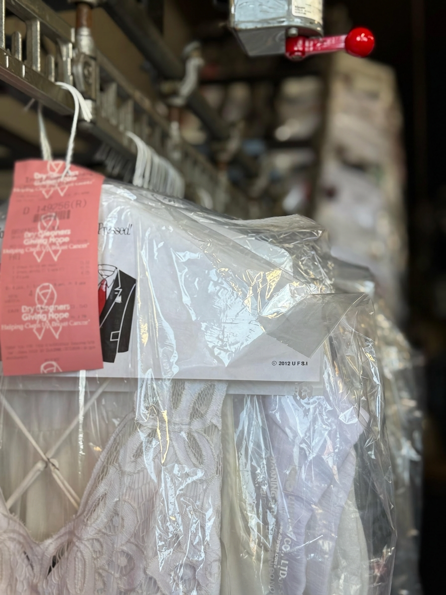 Freshly cleaned garment tagged and ready for pickup at IMIG Park Cleaners